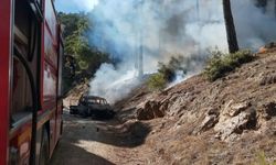 Acıpayam’da araç yangını örtü yangınına neden oldu